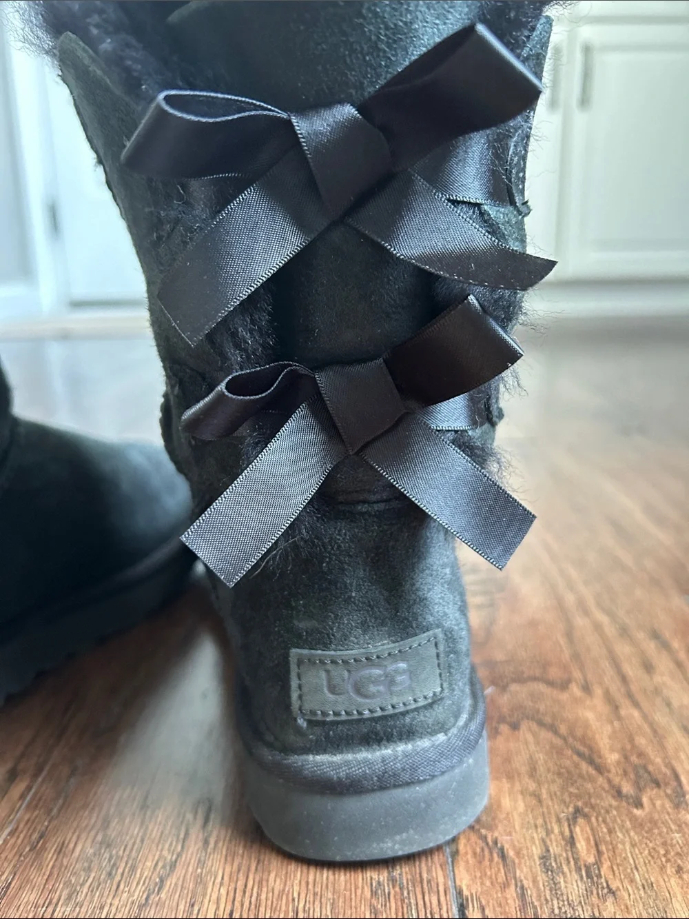 Women's UGG size 7 Black Suede Fur-Lined Ankle Boots with Bow Detail